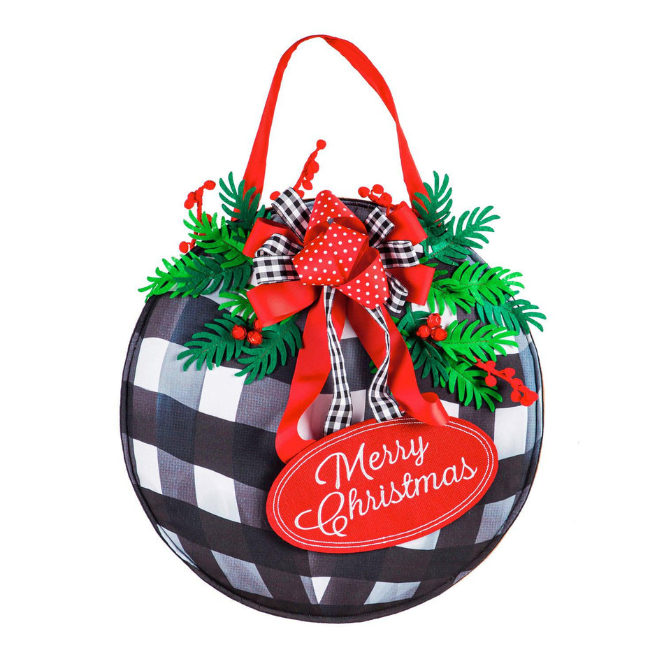 Let the beautiful Buffalo Check Ornament Door Décor greet your visitors this holiday season! It features a checked ornament with bows and pine along with the words "Merry Christmas", and is made from poly-burlap fabric for outdoor use.