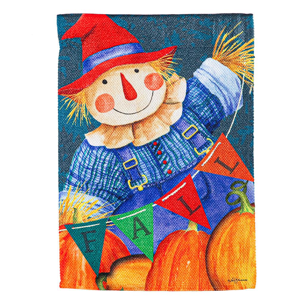 The Fall Fella Scarecrow garden flag features pumpkins and a smiling scarecrow holding a pennant banner that spells out the word "FALL".