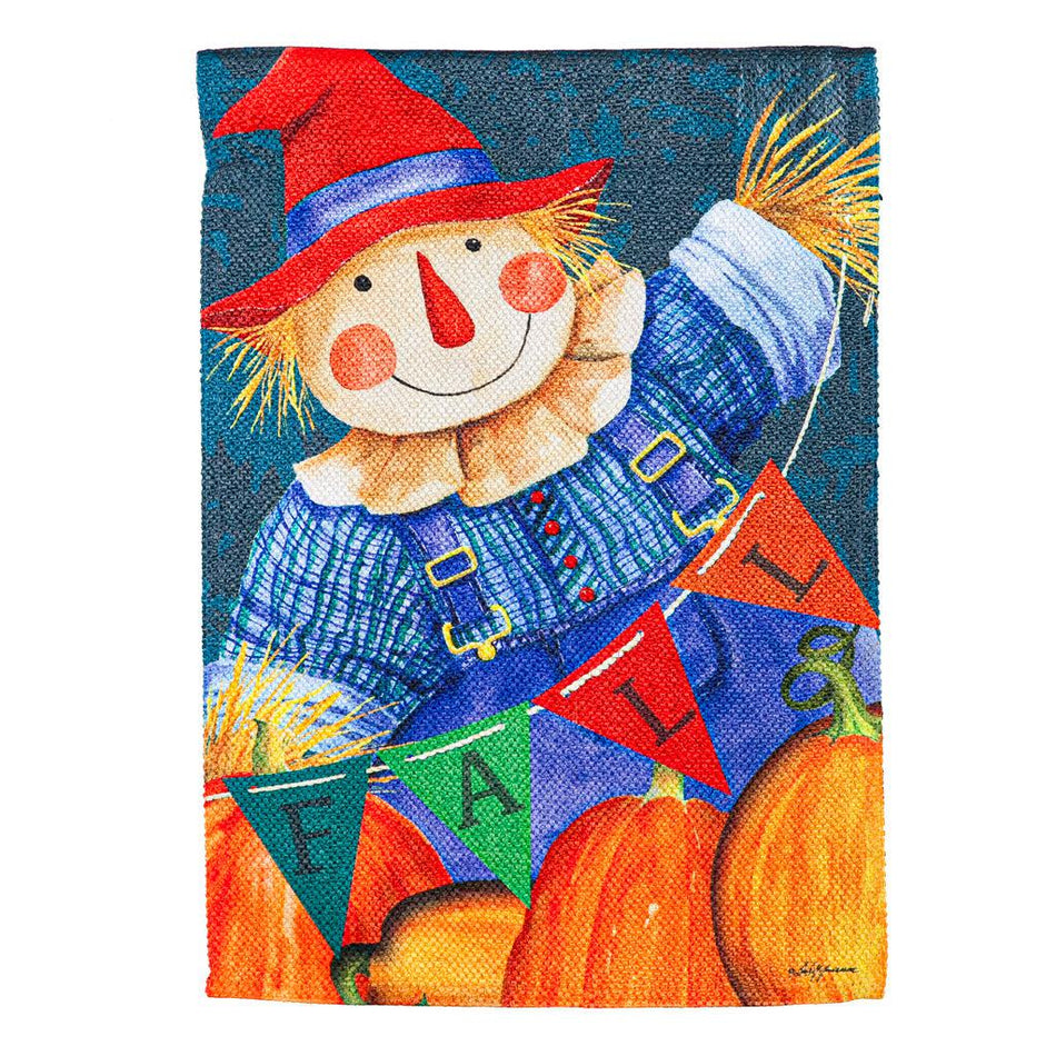 The Fall Fella Scarecrow garden flag features pumpkins and a smiling scarecrow holding a pennant banner that spells out the word "FALL".