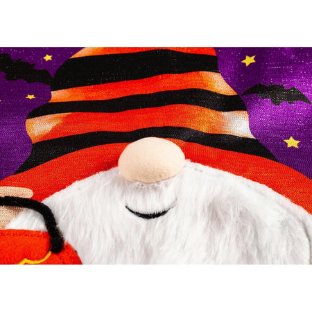 Fuzzy bearded gnome holding a jack o lantern closeup