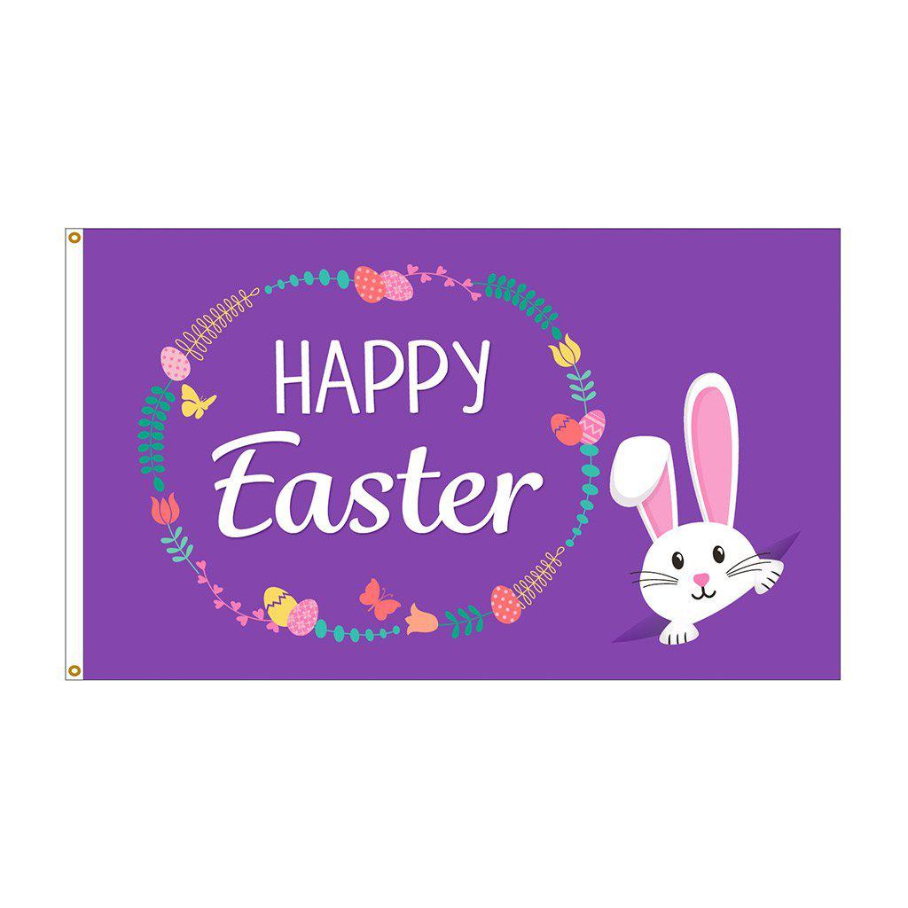 Our Happy Easter Wreath 3' x 5' flag  features a cute bunny peeking out from the corner, eggs and flowers in a wreath design , and "Happy Easter" message on a purple background.