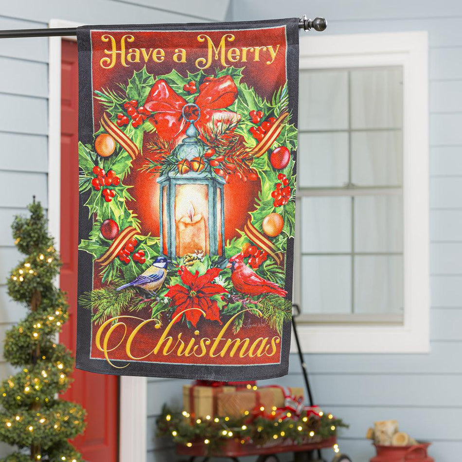 The Have a Merry Christmas Lantern house banner features a vintage lantern surrounded by a holiday wreath and the words "Have a Merry Christmas".