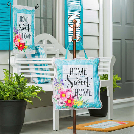 The Home Sweet Home Frame Door Décor features a light blue frame with floral accents and the words "Home Sweet Home".