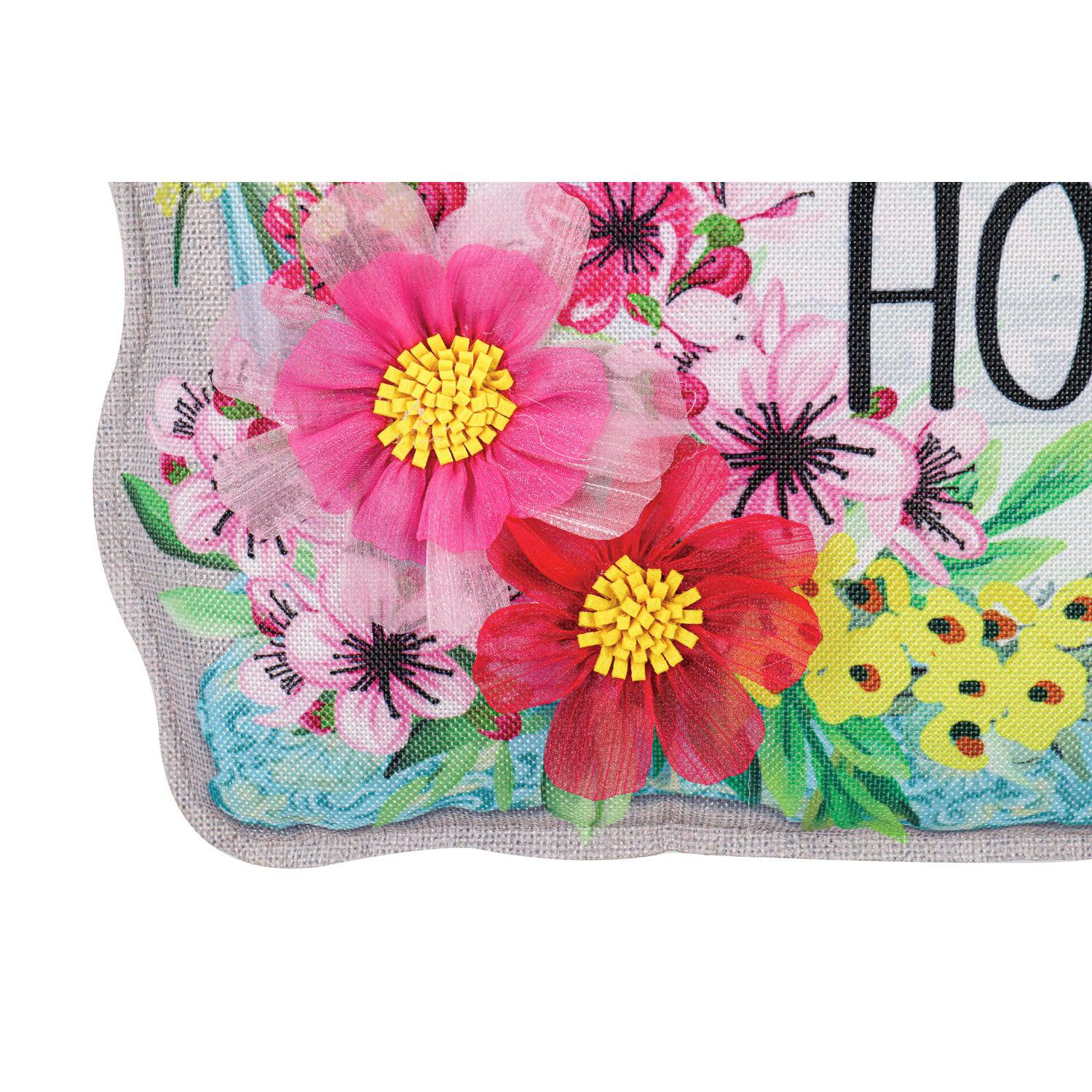 The Home Sweet Home Frame Door Décor features a light blue frame with floral accents and the words "Home Sweet Home".