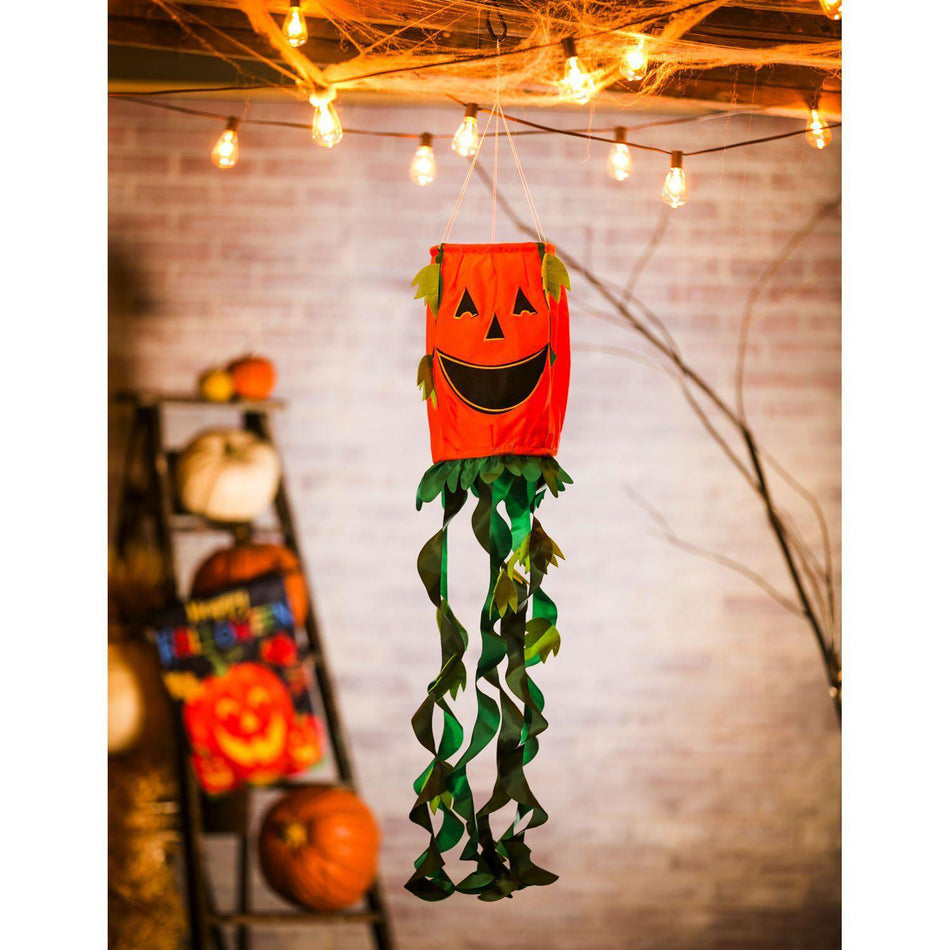 Welcome Halloween with the Jack-O-Lantern 3D windsock featuring a grinning orange jack-o-lantern with bright green vine streamers.