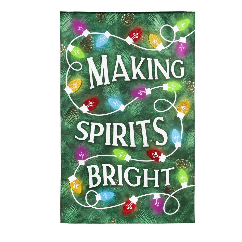 The Making Spirits Bright house banner features a green pine needle background with a string of brightly colored Christmas lights.