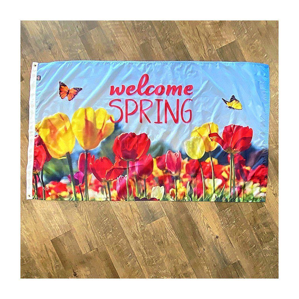 Our Welcome Spring 3' x 5' Flag features colorful tulips, butterflies, and a "Welcome Spring" message on a sky blue background.