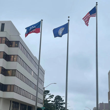 Outdoor Juneteenth flag flown with an American and State flag on flagpoles