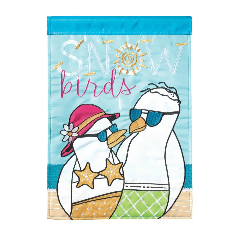 This garden flag features 2 applique seagulls with bathing suits and the words " Snow Birds"