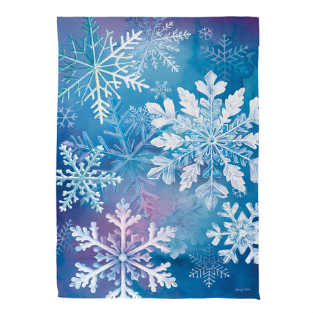 Snowflakes Dance Garden Flag Features layered Snowflakes with a Blue Background
