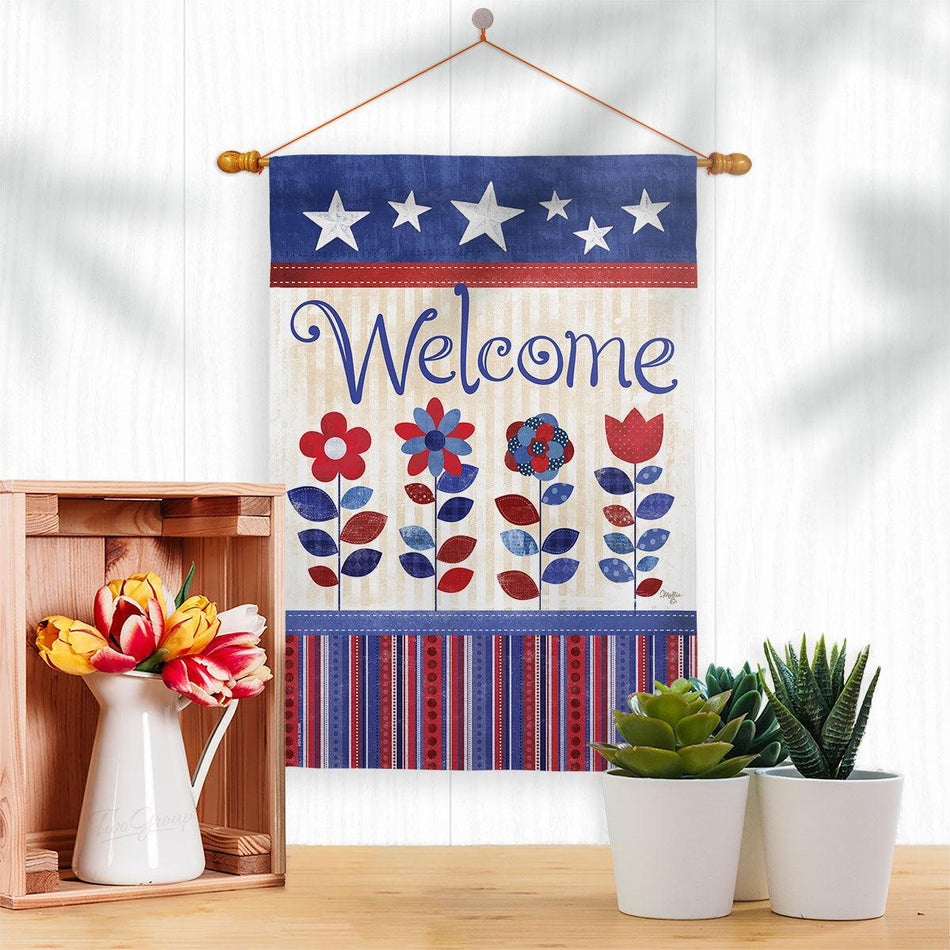 Patriotic welcome garden flag displayed on a dowel