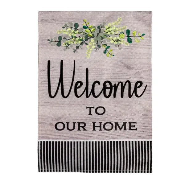 This garden flag features a wood like background with the words welcome to our home 