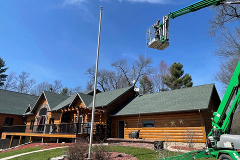 New rope is installed on a residential flagpole
