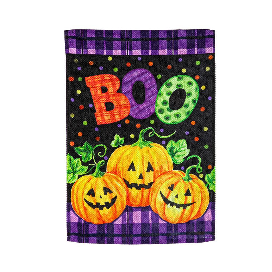 The Boo Jack-O-Lanterns garden flag features a trio of smiling jack-o-lanterns over a purple and black checked and dotted background, and the word "BOO". 