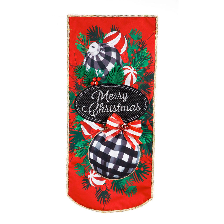 This extra-long garden flag features checked ornaments with candy and bows hanging on pine boughs and the words "Merry Christmas". 