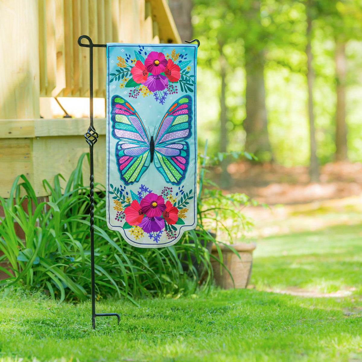 Enjoy the beauty of the Butterfly Floral Textile Décor from the Everlasting Impressions collection. This extra-long garden flag features a stunning multi-colored butterfly with bouquets of flowers at the top and the bottom of the flag.