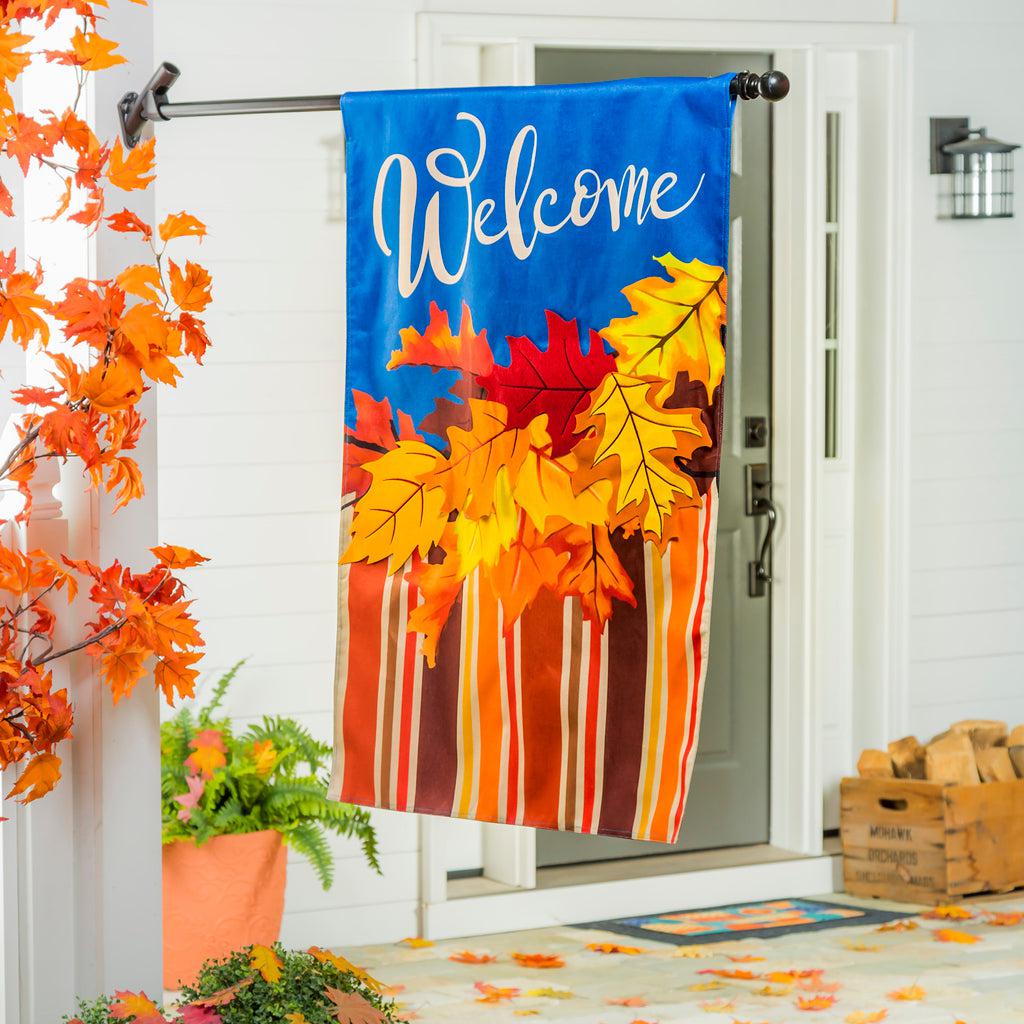 The Cascading Leaves house banner features bright fall leaves with coordinating stripes and the word "Welcome" across a vivid blue top.
