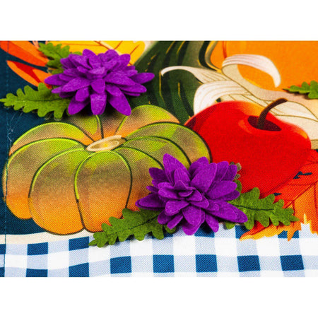 The Cornucopia With Checks garden flag features a cornucopia with fall fruits and vegetables and the words "Always Be Thankful". 