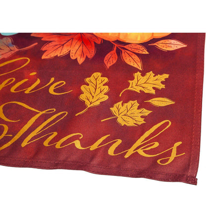 The Crafted harvest garden flag features brilliantly colored Autumn leaves, pumpkins, and the words "Give Thanks". 