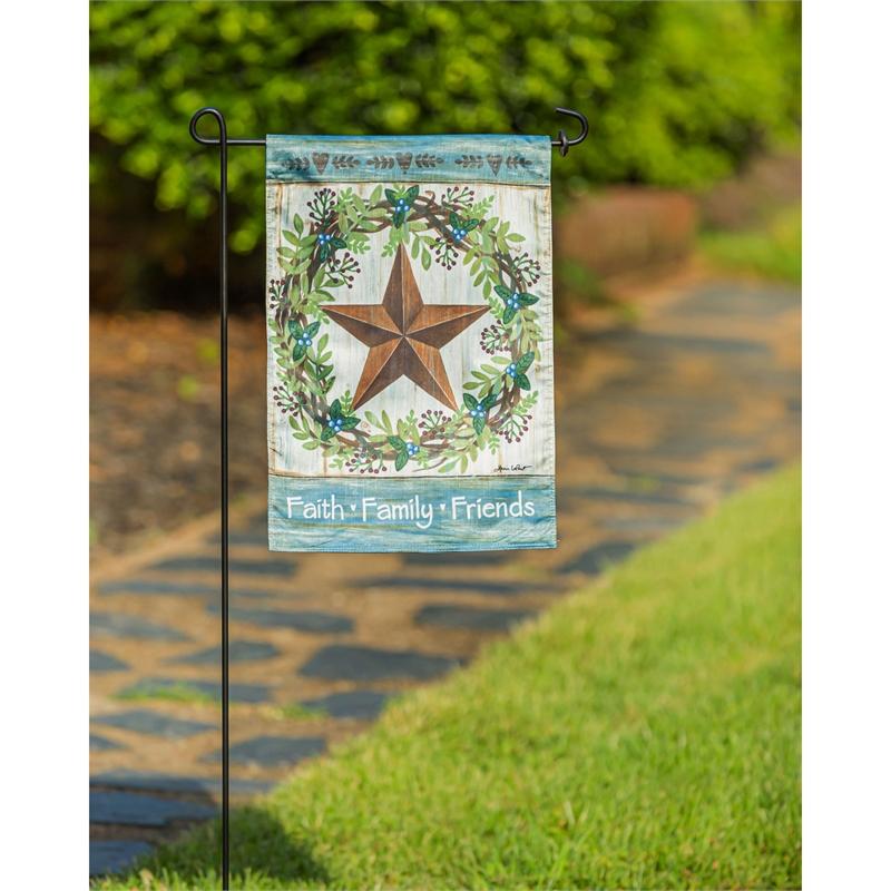 The Faith Family Friends Country Star garden flag features a country star surrounded by a wreath as well as the words "Faith Family Friends" across the bottom of the flag.