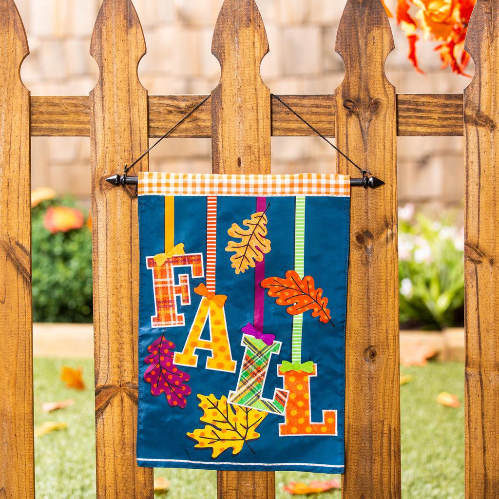 The Falling Leaves garden flag features the word "Fall" and autumn leaves dangling from ribbons. All have bright fall colors and patterns.