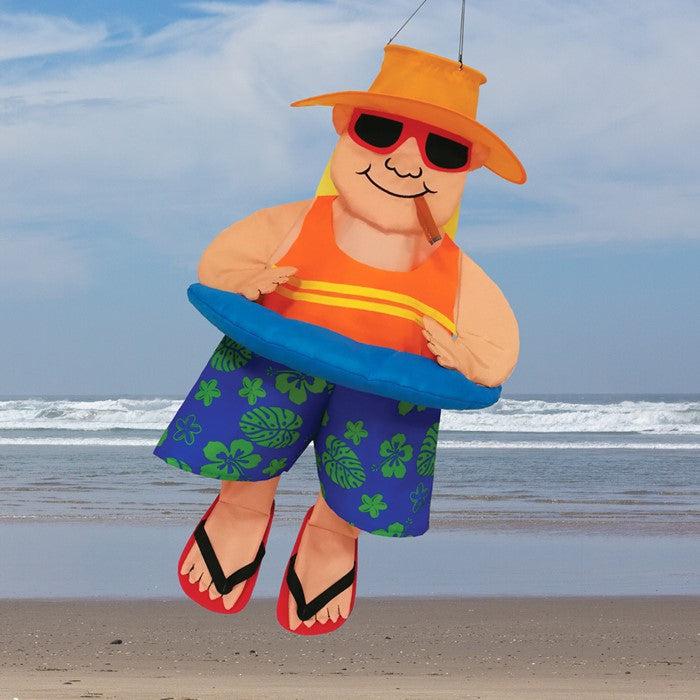 The 3D Float Man With Cigar windsock has detailed appliquéd design and embroidered accents. Measuring 30”, this windsock features a man in swim trunks, tank top, flip-flops, hat and sunglasses smoking a cigar and wearing an inner tube around his belly.