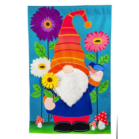 The brightly colored Garden Gnome garden flag features a charming gnome standing among flowers while holding a flower and a bluebird. 