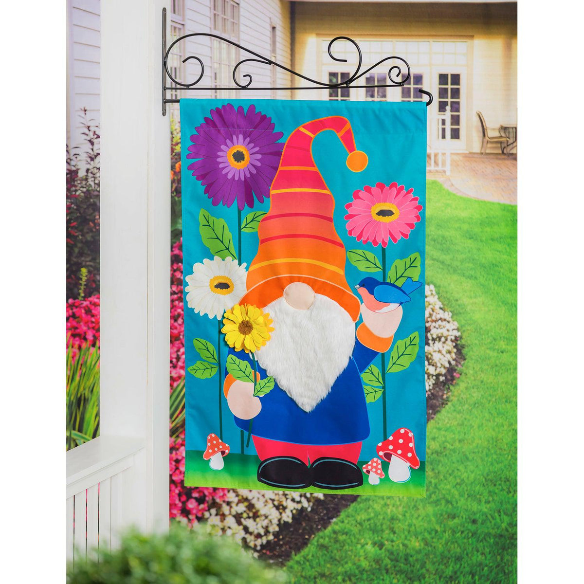 The brightly colored Garden Gnome house banner features a charming gnome standing among flowers while holding a flower and a bluebird. 