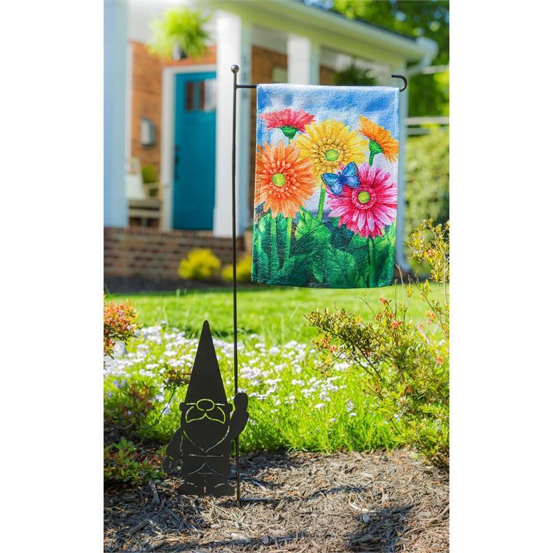 The Gerbera Daisies garden flag features brightly colored flowers on a sky blue background.