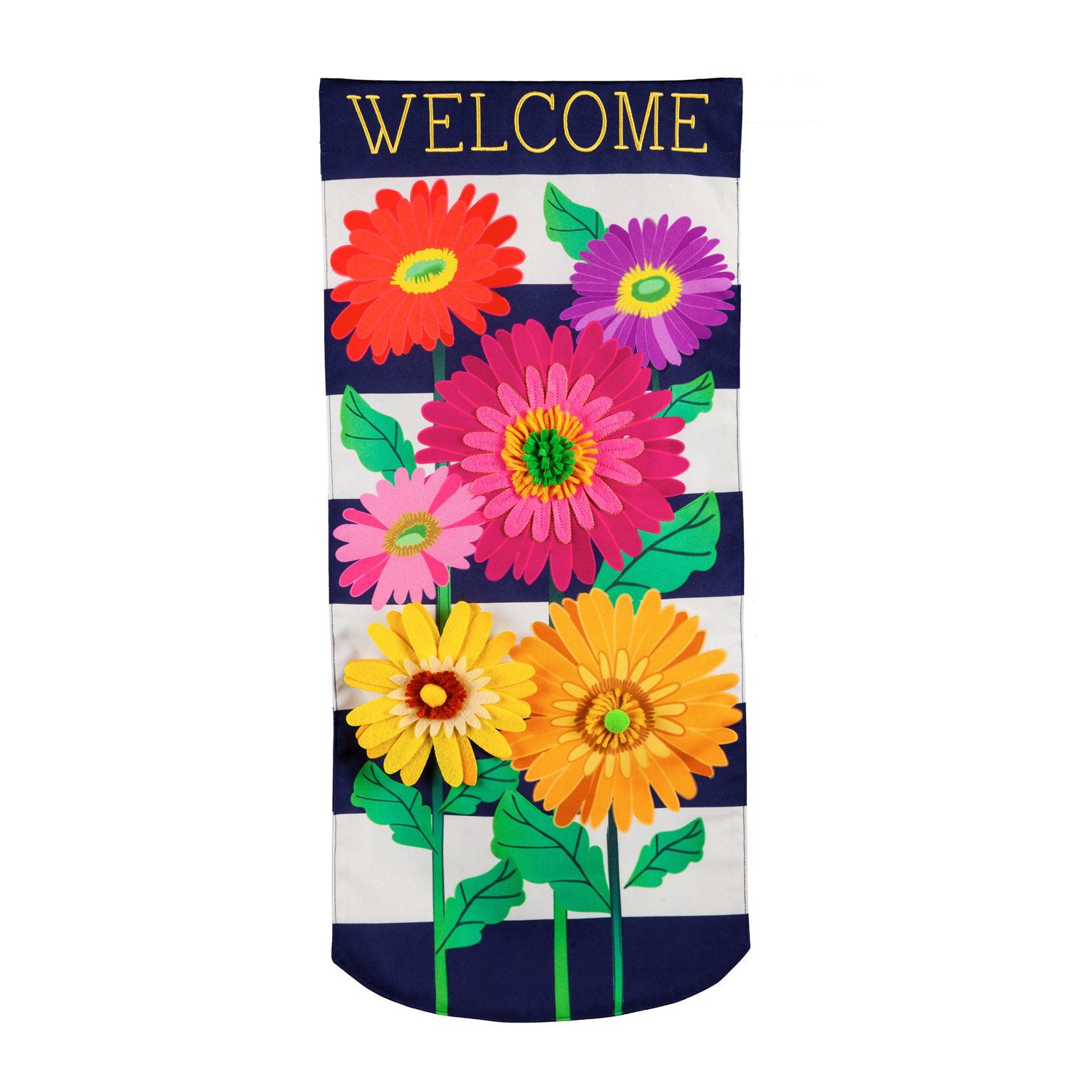Enjoy the beauty of the Gerbera Daisy Stripe Textile Décor from the Everlasting Impressions collection. This extra-long garden flag features colorful gerbera daisies over a navy and white striped background and the word "Welcome" across the top.