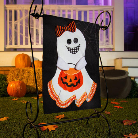The Girl and Boy Ghost Reversible garden flag features a grinning girl ghost holding a pumpkin basket on the front, and a grinning boy ghost with the word "BOO!" on the back. 