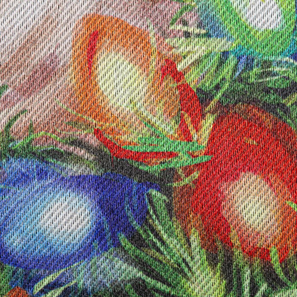 The Gnome With a Christmas Wreath garden flag features a smiling gnome sporting a pine wreath decorated in Christmas lights. 