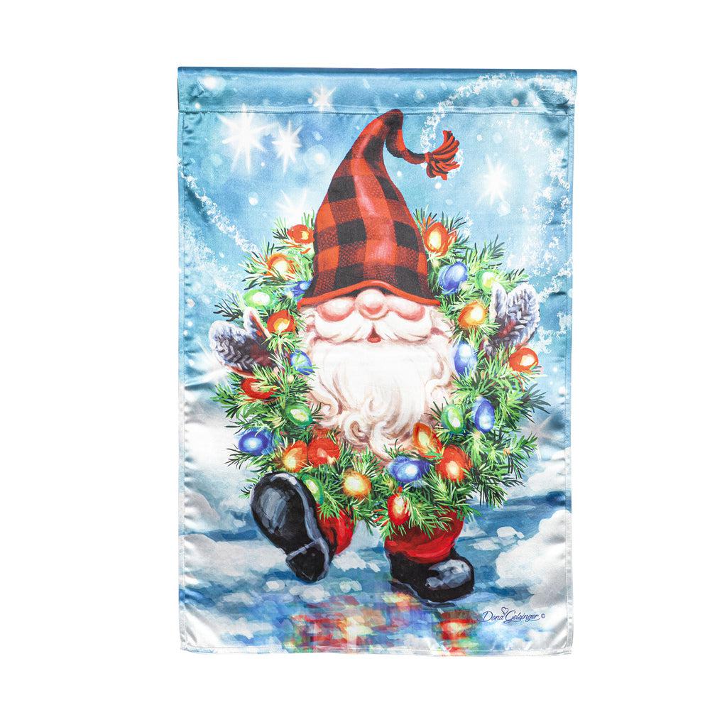 The Gnome With a Christmas Wreath house banner features a smiling gnome sporting a pine wreath decorated in Christmas lights. 
