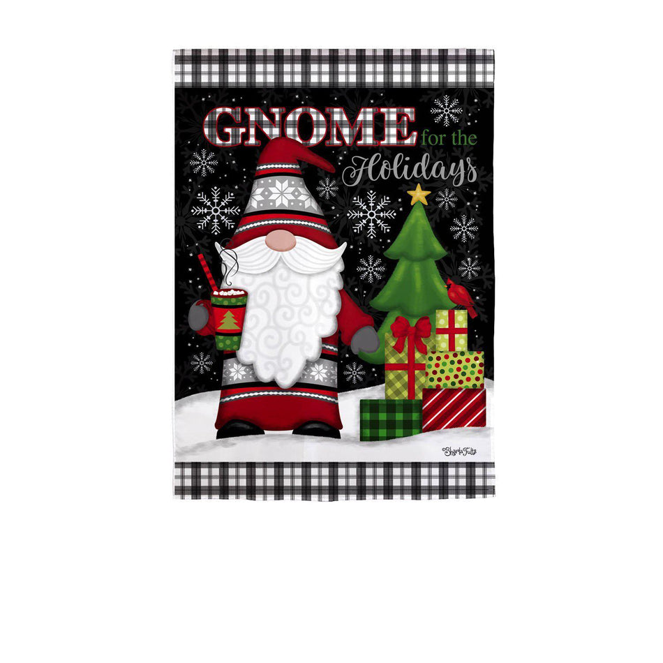The Gnome for the Holidays garden flag features a Santa gnome next to a tree with presents along with the words "Gnome for the Holidays".