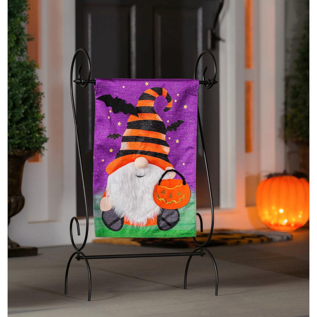 Celebrate the holiday with our Halloween Gnome garden flag, featuring an adorable fuzzy-bearded gnome holding a jack-o-lantern. 