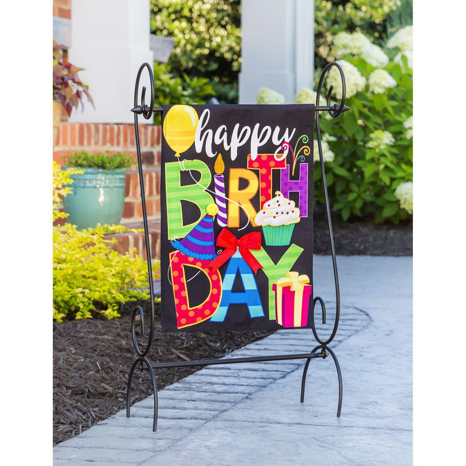 The two-sided Happy Birthday garden flag features a balloon, cupcake, candle, bow, presents, and the words "Happy Birthday"!