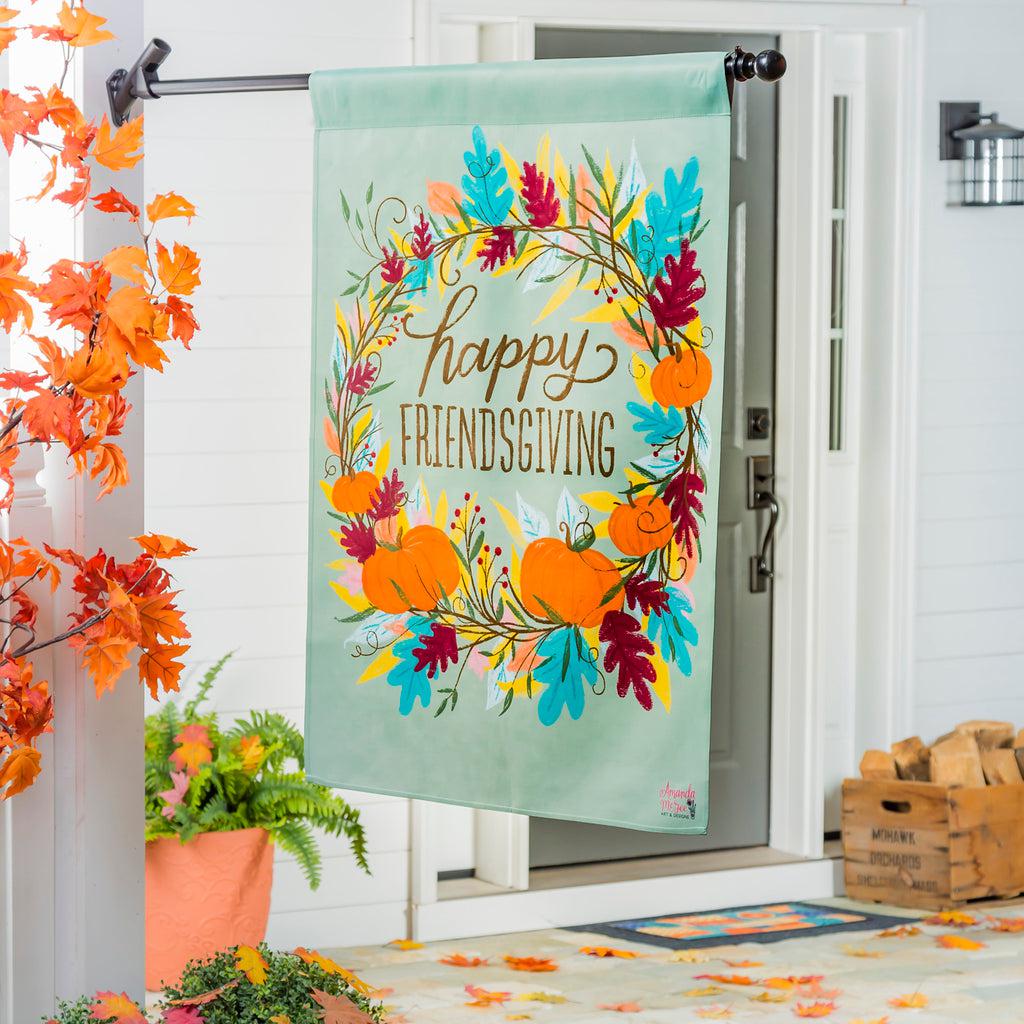 The Happy Friendsgiving house banner features a wreath of fall leaves and pumpkins around the words "Happy Friendsgiving". 