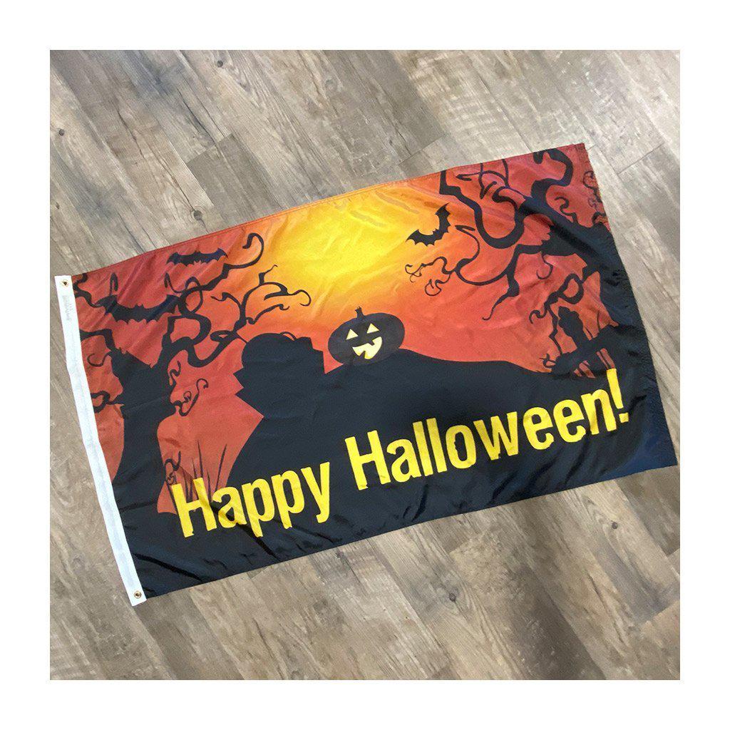 Happy Halloween jack-O-Lantern 3' x 5' flag features a jack-o-lantern and spooky trees in orange and black and the words "Happy Halloween" in yellow.