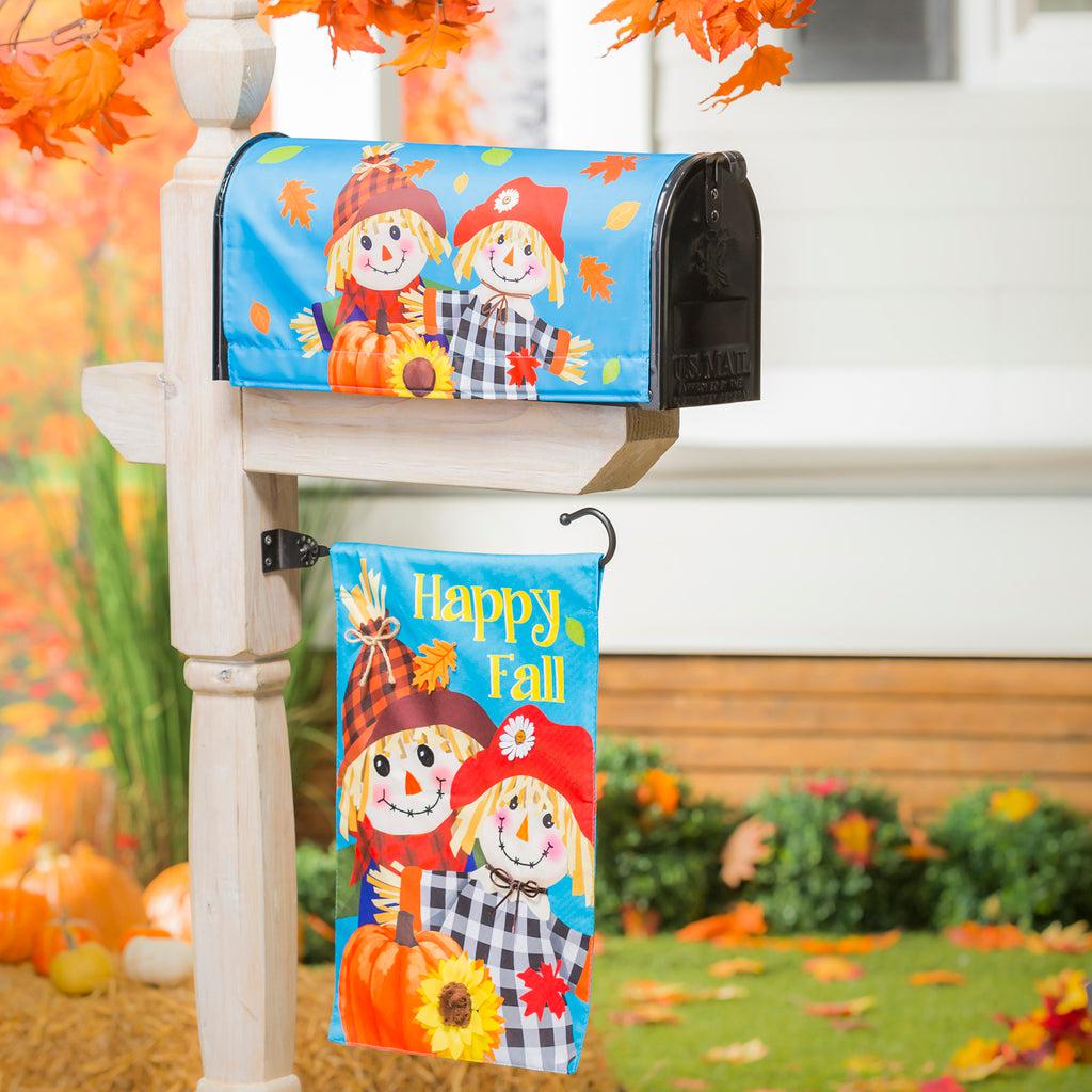 Our Happy Scarecrow Couple garden flag features a pair of smiling scarecrows with a pumpkin and the words "Happy Fall".  