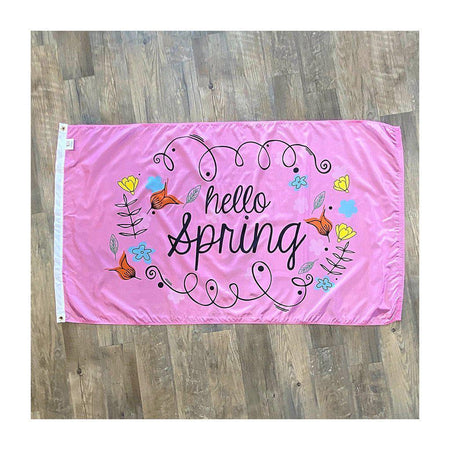 Our Hello Spring 3' x 5' Flag features whimsical flowers and "Hello Spring" message on a pink background. 