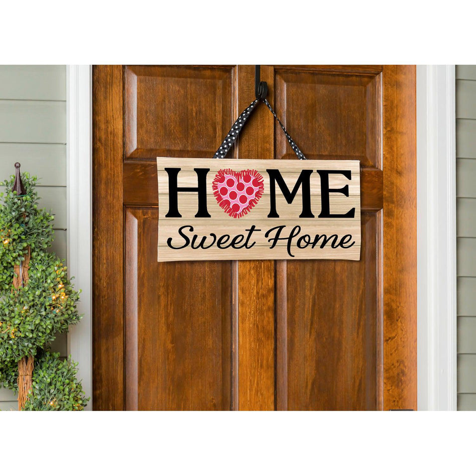 The Spring Home Sweet Home Interchangeable Door Décor lasts all spring long by simply switching out the pinned on heart, shamrock, bunny, and flower.