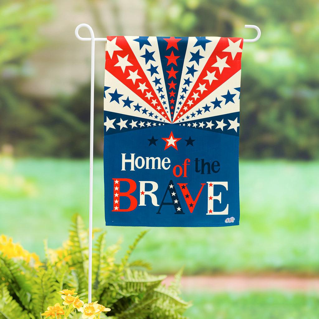 The Home of the Brave garden flag features stars and stripes fanning across the top half and the words "Home of the Brave" on the bottom half.