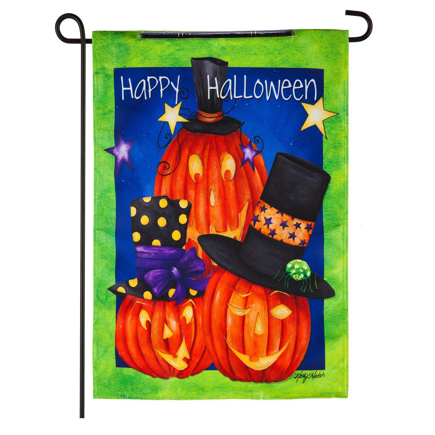 The Jack-O-Lantern Trio Solar LED garden flag features three smiling jack-o-lanterns with black top hats and the words "Happy Halloween". 