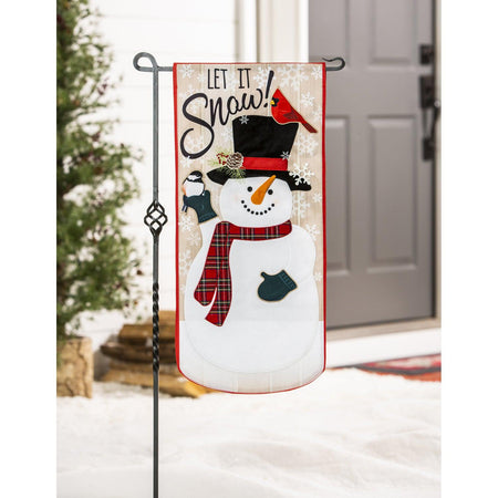 Celebrate the season with our Let it Snow! Textile Decor from the Everlasting Impressions collection. This extra-long garden flag features a snowman and songbirds with embroidered details and metallic lettering. 