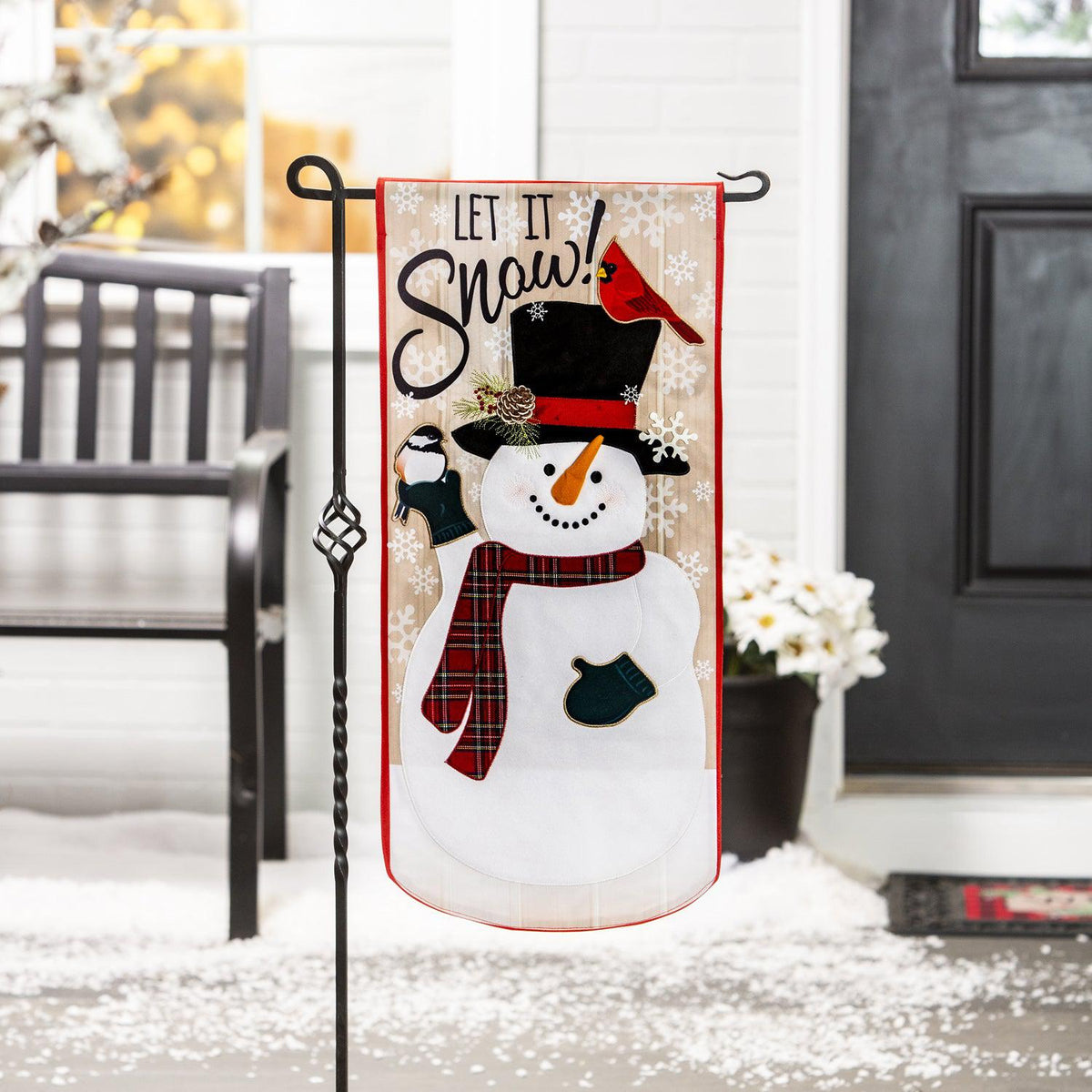 Celebrate the season with our Let it Snow! Textile Decor from the Everlasting Impressions collection. This extra-long garden flag features a snowman and songbirds with embroidered details and metallic lettering. 