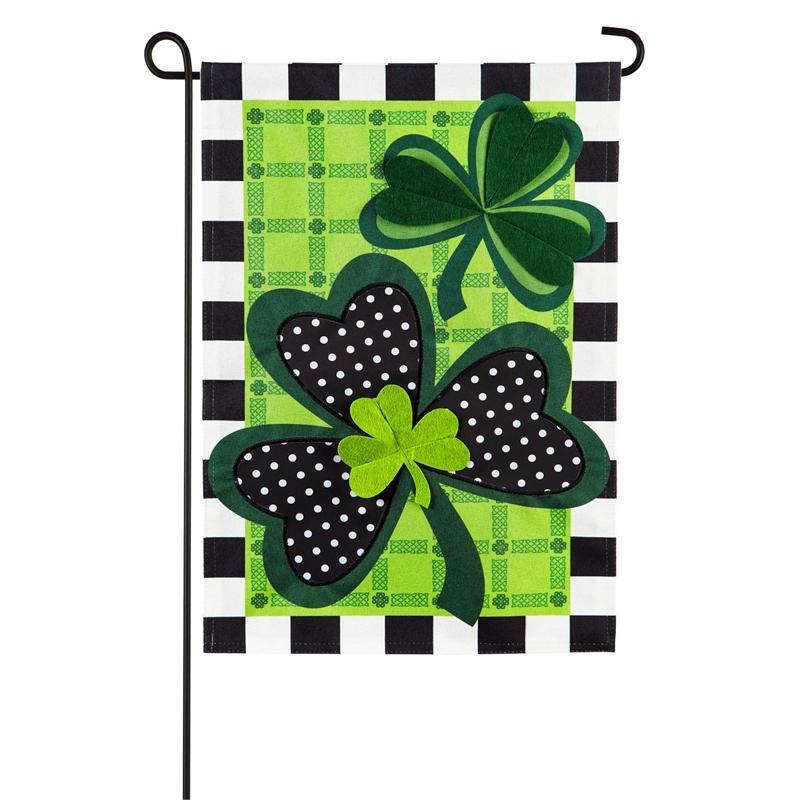 The Mixed Print Shamrocks garden flag features shamrocks, plaids, polka dots and blocks in shades of green, black and white. 