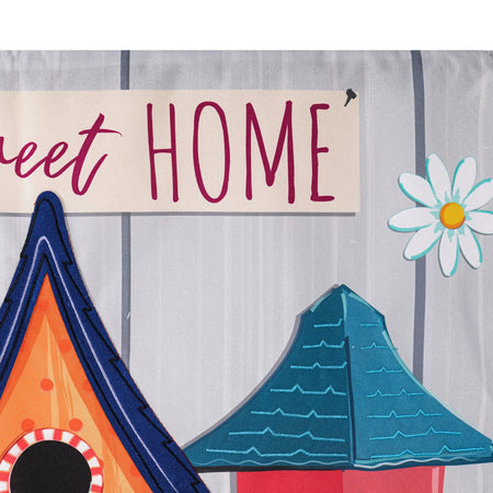 The Ornate Birdhouses garden flag features cute birdhouses in a variety of colors and styles, and the words "Home Tweet Home" across the top. 