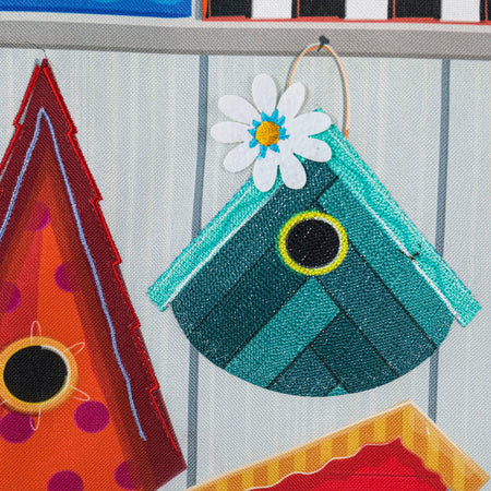 The Ornate Birdhouses garden flag features cute birdhouses in a variety of colors and styles, and the words "Home Tweet Home" across the top. 