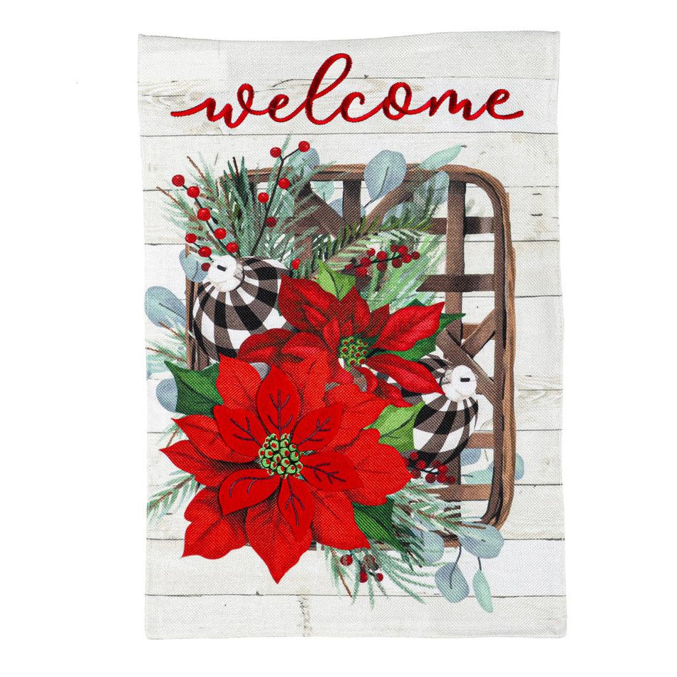 The Poinsettia Tobacco Basket garden flag features red poinsettias and buffalo checked ornaments on a tobacco basket with the word "Welcome" across the top.