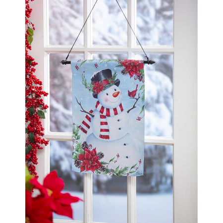The Poinsettia Snowman garden flag features a smiling snowman accented by red poinsettias. 